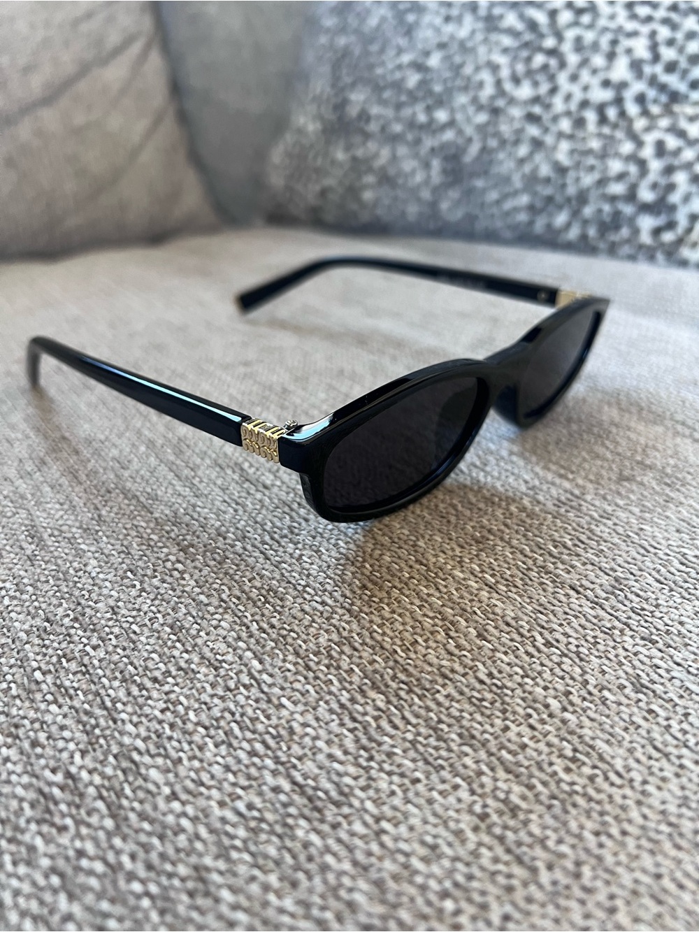Miu Miu Black Sunglasses with Gold Accent - Classic Cat-Eye Style